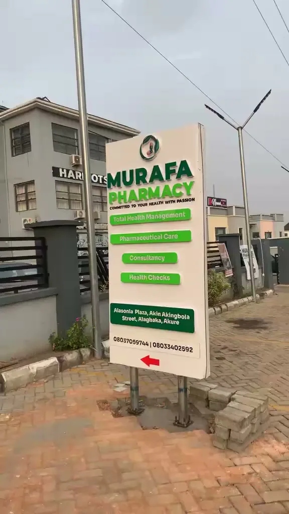 Murafa Pharmacy sign beside the road in Alagbaka